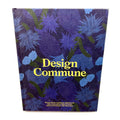 The cover of 'Design Commune,' a visually striking book featuring bold floral artwork in shades of blue and green, with yellow typography. This book showcases the creative philosophy and design approach of Commune.